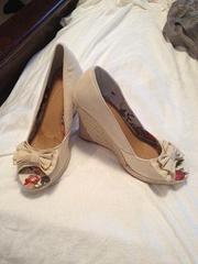 Cream Wedges size 8.