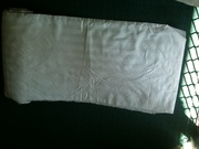 Aprox. 40 Meters of White satin stripe,  rubber lined curtin material 