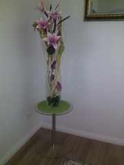 Round glass table with arrangement