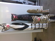 family of wooden cats all different